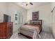 Bedroom with shutters, neutral paint, a queen bed, and a large closet at 1813 N Trowbridge --, Mesa, AZ 85207