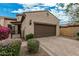 Inviting home exterior with desert landscaping and a paved driveway leading to a two-car garage at 1813 N Trowbridge --, Mesa, AZ 85207