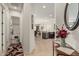 Inviting foyer with a view of the open-concept kitchen and living area, creating a welcoming ambiance at 1813 N Trowbridge --, Mesa, AZ 85207