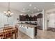 Well-lit kitchen featuring stainless steel appliances, granite countertops, and ample storage space at 1813 N Trowbridge --, Mesa, AZ 85207