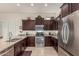 Spacious kitchen featuring stainless steel appliances, granite countertops, and ample storage space at 1813 N Trowbridge --, Mesa, AZ 85207