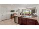 Spacious kitchen with granite countertops and stainless steel appliances with view to backyard at 1813 N Trowbridge --, Mesa, AZ 85207