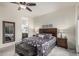 Comfortable main bedroom features dark wood furnishings, ceiling fan and ample natural light at 1813 N Trowbridge --, Mesa, AZ 85207