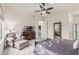 Cozy main bedroom with reading chair, dresser, and dark wood furnishings at 1813 N Trowbridge --, Mesa, AZ 85207