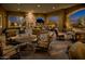Comfortable outdoor seating area with a cozy fireplace, ideal for relaxation and social gatherings at 1813 N Trowbridge --, Mesa, AZ 85207