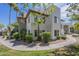 Inviting exterior showcasing a two-story home with landscaped yard and a well-maintained walkway on a beautiful sunny day at 1825 W Ray Rd # 2074, Chandler, AZ 85224