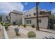 Inviting condo exterior featuring manicured landscaping and a pathway leading to the entrance under a blue sky at 1825 W Ray Rd # 2074, Chandler, AZ 85224
