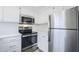 Modern kitchen features stainless steel appliances and ample cabinet space at 1825 W Ray Rd # 2074, Chandler, AZ 85224