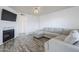 Spacious living room featuring a fireplace, television, comfortable couch, and wood-look floors at 1825 W Ray Rd # 2074, Chandler, AZ 85224