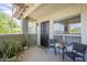 Inviting outdoor patio featuring a dark front door, seating, potted plants, and natural light at 1825 W Ray Rd # 2074, Chandler, AZ 85224