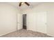 The bedroom features neutral carpet and walls with a closet and attached bath at 1867 S Seton Ave, Gilbert, AZ 85295