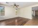 Bright living room with stylish ceiling fan and multiple windows at 1867 S Seton Ave, Gilbert, AZ 85295