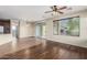 Inviting living space featuring hardwood flooring and sliding glass door at 1867 S Seton Ave, Gilbert, AZ 85295
