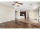 Open living area with hardwood floors, connecting to kitchen with stainless appliances at 1867 S Seton Ave, Gilbert, AZ 85295