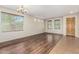 Spacious living area with abundant natural light, hardwood and neutral color palette at 1867 S Seton Ave, Gilbert, AZ 85295