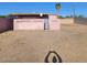 Exterior view of a home with a gravel backyard and a view of the building structure at 1916 N 22Nd St, Phoenix, AZ 85006