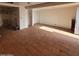 An empty living room with terracotta floors and an open floor plan, ready for customization at 1916 N 22Nd St, Phoenix, AZ 85006