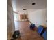 A spacious living room featuring terracotta tile flooring and an open floor plan layout at 1916 N 22Nd St, Phoenix, AZ 85006