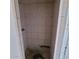 A tiled shower stall with a shower head, faucet and in need of repair at 1916 N 22Nd St, Phoenix, AZ 85006