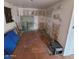 A bright, unfinished room shows tile floors and walls in need of repair or remodel at 1916 N 22Nd St, Phoenix, AZ 85006