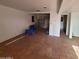 Large unfinished room features tile floors, potential for customization, with some building materials visible at 1916 N 22Nd St, Phoenix, AZ 85006