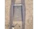 Close-up of a recessed water meter box with a textured lid in a residential area at 1916 N 22Nd St, Phoenix, AZ 85006