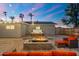 Relaxing backyard with a hot tub, fire pit, and comfortable seating, perfect for cozy evenings at 2045 N 68Th St, Scottsdale, AZ 85257