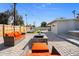 Spacious backyard featuring a patio, lounging area, outdoor seating and a hot tub at 2045 N 68Th St, Scottsdale, AZ 85257