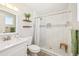 Updated bathroom with tiled shower, wood shelves, and modern fixtures at 2045 N 68Th St, Scottsdale, AZ 85257