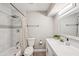 Updated bathroom with a shower/tub, a white vanity, and mosaic tile accents at 2045 N 68Th St, Scottsdale, AZ 85257