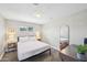 Bedroom with a queen bed, desk, and a window offering plenty of natural light at 2045 N 68Th St, Scottsdale, AZ 85257