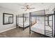 Bedroom featuring two sets of black metal bunk beds, neutral paint and carpet at 2045 N 68Th St, Scottsdale, AZ 85257