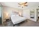 Bedroom featuring a queen-sized bed, ceiling fan, closet, and carpeted floors at 2045 N 68Th St, Scottsdale, AZ 85257