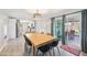 Open concept dining area with sliding doors to the backyard and kitchen access at 2045 N 68Th St, Scottsdale, AZ 85257