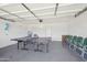 Large garage with epoxy flooring and a ping pong table for recreation at 2045 N 68Th St, Scottsdale, AZ 85257