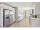 Modern kitchen featuring white cabinets, stainless steel appliances, and stylish backsplash at 2045 N 68Th St, Scottsdale, AZ 85257