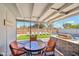 Outdoor patio featuring a glass-top table, seating, grill, and view of pool at 2045 N 68Th St, Scottsdale, AZ 85257