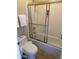 Bathroom with a standard tub and shower featuring sliding glass doors at 20660 N 40Th St # 2016, Phoenix, AZ 85050
