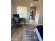 Bedroom with desk area, featuring wood floors and natural light at 20660 N 40Th St # 2016, Phoenix, AZ 85050