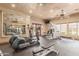 Community fitness center with modern equipment, mirrors, and ceiling fan at 20660 N 40Th St # 2016, Phoenix, AZ 85050