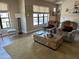 Bright living room with wood flooring, neutral walls, and comfortable seating at 20660 N 40Th St # 2016, Phoenix, AZ 85050