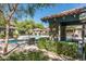 Tranquil community pool with covered seating, lounge chairs, and mature landscaping at 20660 N 40Th St # 2016, Phoenix, AZ 85050