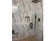 Modern shower with rainfall head, pebble floor and elegant marble-look tile at 20660 N 40Th St # 2016, Phoenix, AZ 85050