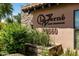 Exterior sign for La Verne Luxury Condominiums with lush desert landscaping at 20660 N 40Th St # 2016, Phoenix, AZ 85050