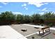 Park area features a cornhole setup and a seating area for community fun at 2425 E Beverly Rd, Phoenix, AZ 85042