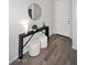 Bright entryway featuring stylish console table with stools and a decorative mirror at 2425 E Beverly Rd, Phoenix, AZ 85042