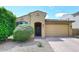 Charming single-story home with a well-manicured front yard and a two-car garage at 2425 E Beverly Rd, Phoenix, AZ 85042
