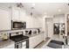 Well-equipped kitchen featuring granite countertops and stainless steel appliances at 2425 E Beverly Rd, Phoenix, AZ 85042