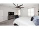 Comfortable bedroom featuring a large bed, media center, and a cozy armchair at 2425 E Beverly Rd, Phoenix, AZ 85042