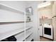 Well-organized pantry with multiple shelves providing ample storage space for food and household items at 2425 E Beverly Rd, Phoenix, AZ 85042
